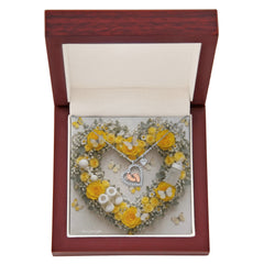 Heart Necklace and Baby Feet -Yellow Roses Background Design